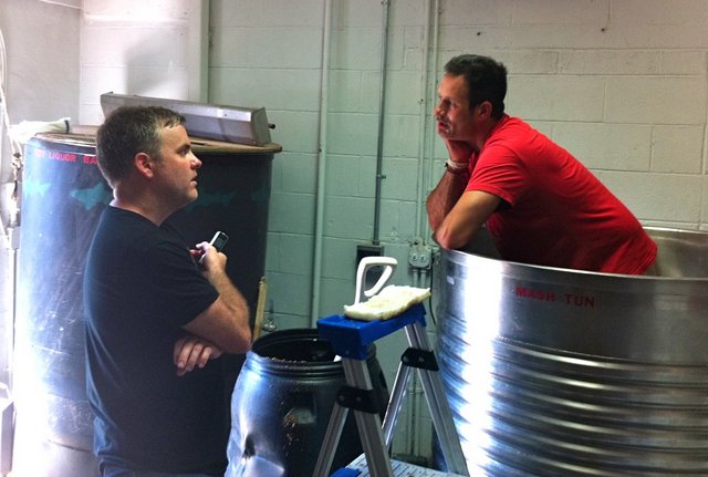 Sam Calagione and I chatting in the experimental brewhouse of our Rehoboth Beach brewpub, the room where continual hopping was invented.