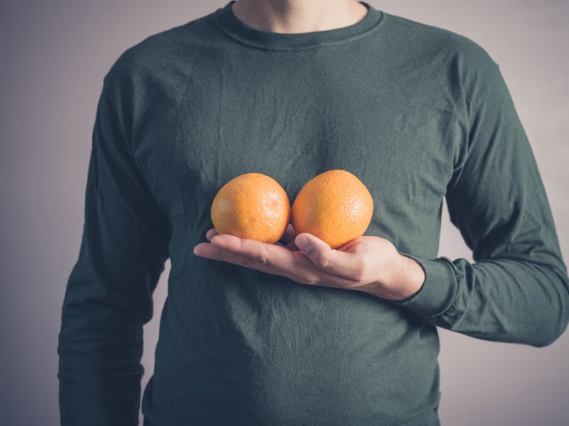 man boobs guy oranges breasts