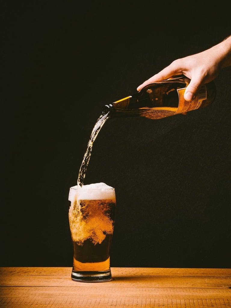 Bottle beer pouring glass