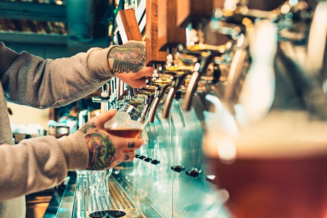 bartender employee beer pour tulip glasses