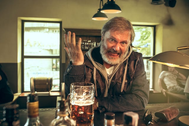 Old guy angry beer bar hand up unhappy mad