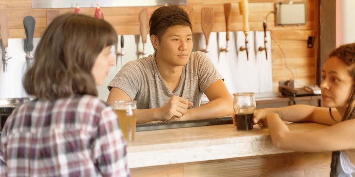 taproom-guests-interacting-with-bartender