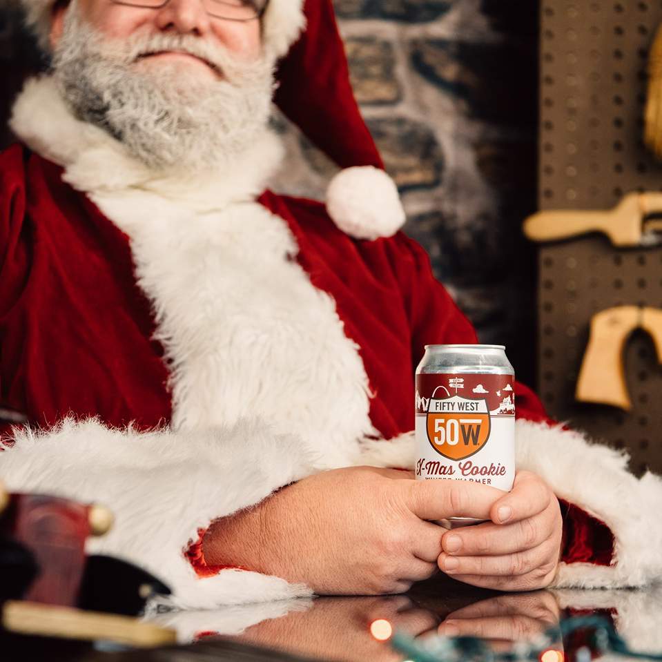 Fifty West Brewing Santa Clause drinks a beer