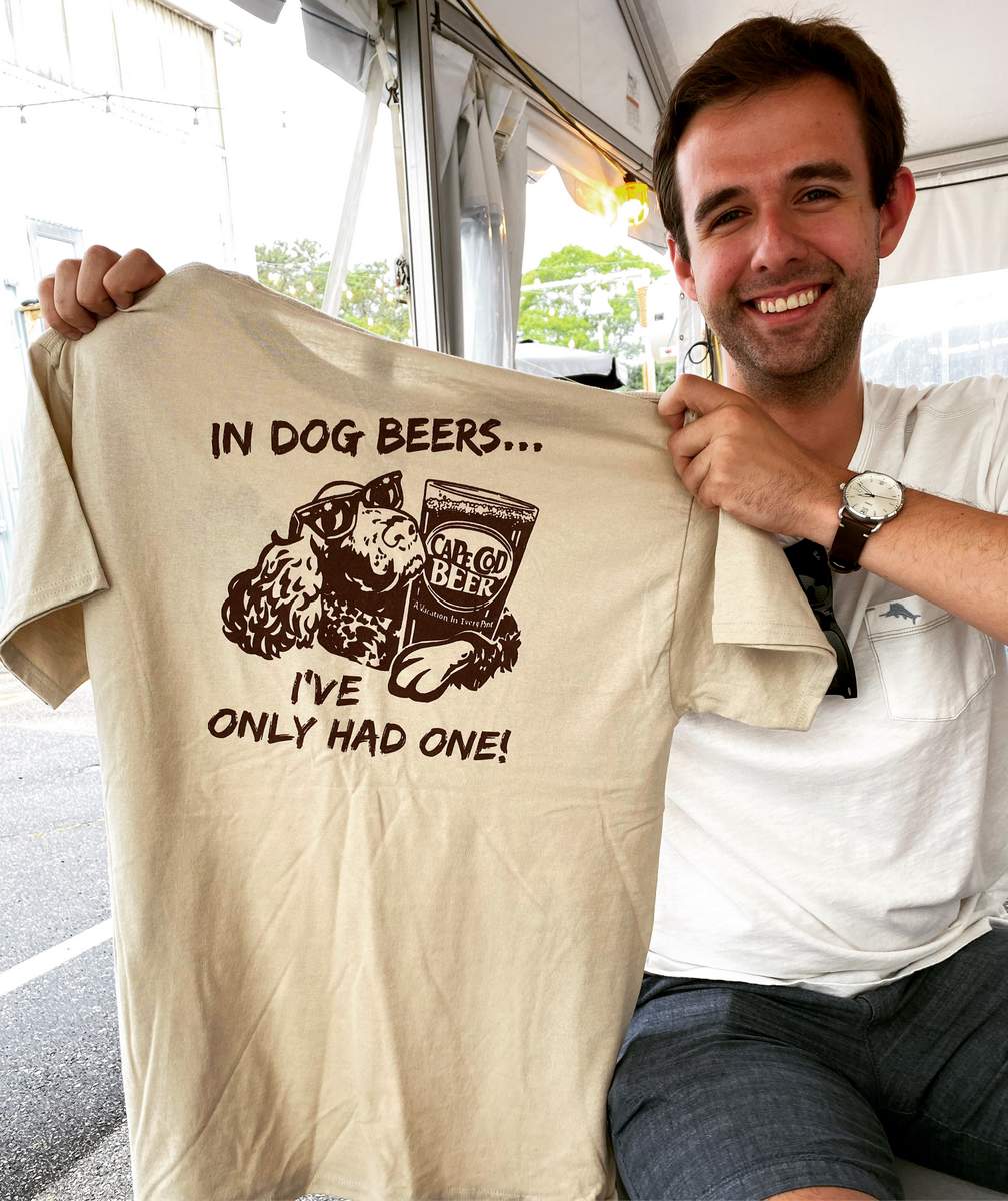 Michael Varda from Craft Beer Advisory Services holding a shirt that says In dog beers, I've only hade one